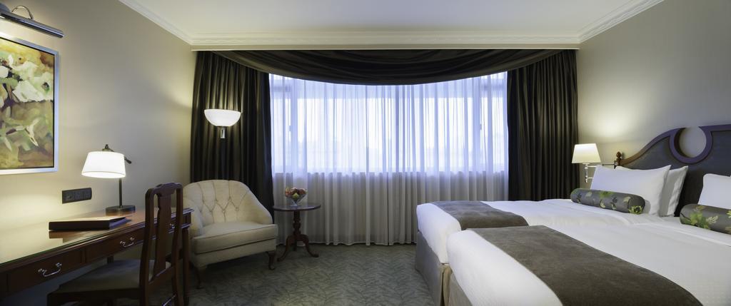 Continental Club Deluxe Kamer met 1 Kingsize Bed of 2 Gescheiden Bedden